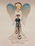 Handcrafted glass angel holding a blue heart crystal with gold and crystal accents
