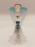 Handcrafted glass angel holding a blue heart-shaped crystal on beveled mirror base with gold and crystal accents