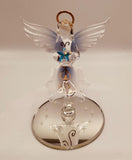 Handcrafted glass angel holding a star with crystal and 22Kt gold accents on a beveled mirror