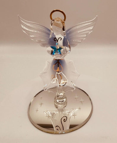 Handcrafted glass angel holding a star with crystal and 22Kt gold accents on a beveled mirror