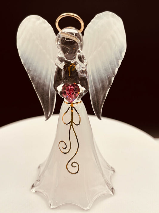 White angel figurine with heart-shaped crystal for spiritual décor