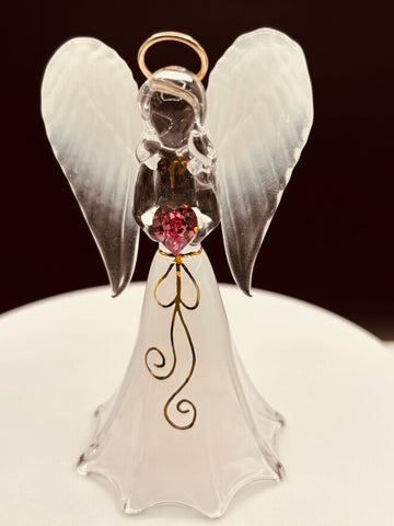 White angel figurine with heart-shaped crystal for spiritual décor