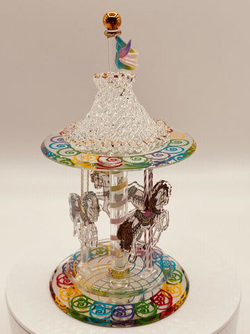 Handcrafted spinning glass carousel with horses and hand-stitched glass top accented with 22Kt gold