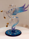 Handcrafted glass Pegasus figurine among the stars with crystal and gold accents on a blue mirror base