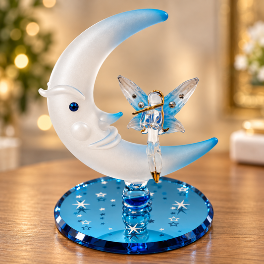 Handcrafted glass fairy figurine with blue wings and frosted crescent moon on blue glass mirror base