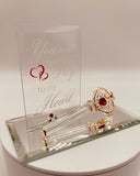 Handcrafted glass key on mirror base with message “You hold the Key to my Heart” accented with crystal and gold details