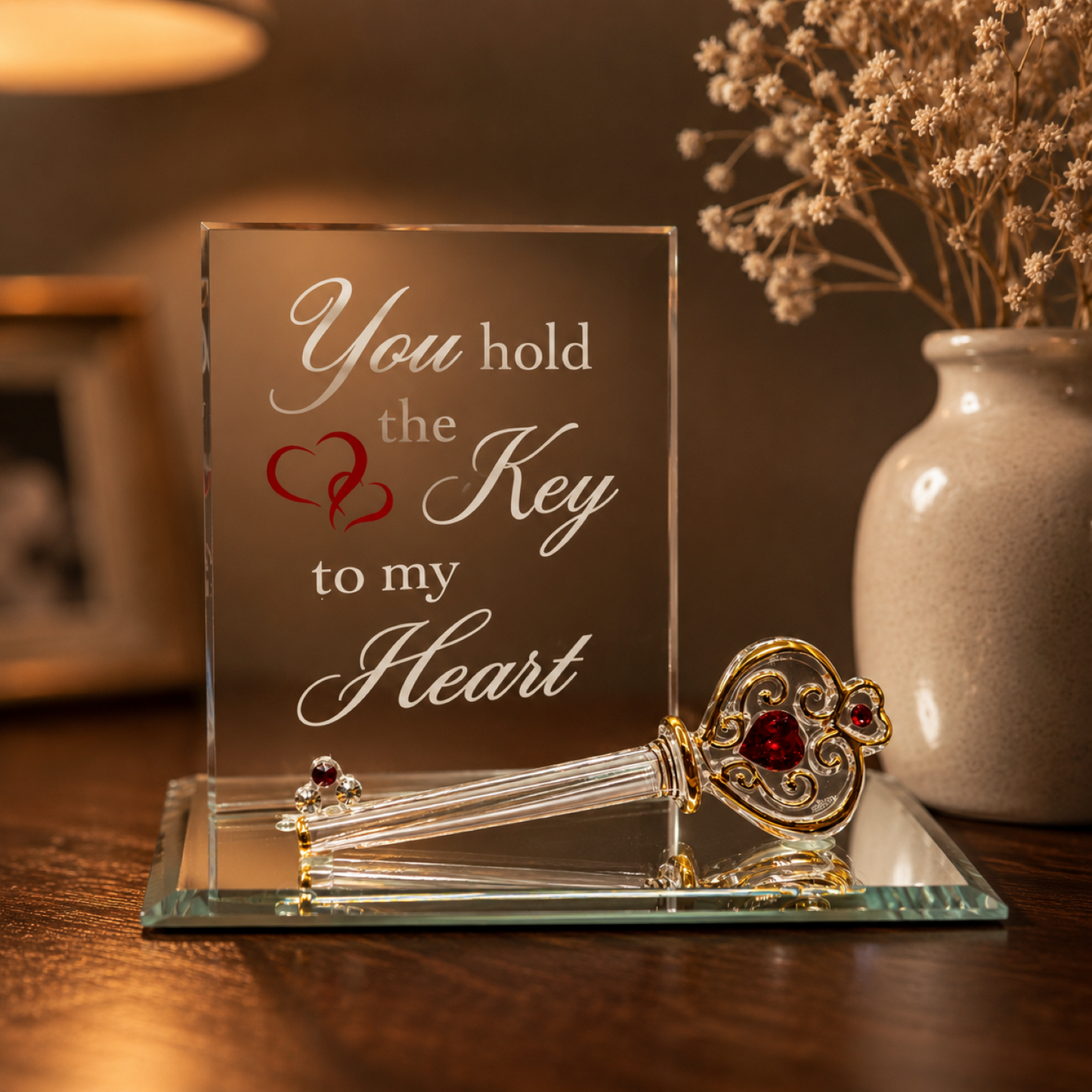 Handcrafted glass key figurine with red crystal accents and "You hold the Key to my Heart" sentiment on mirror base.