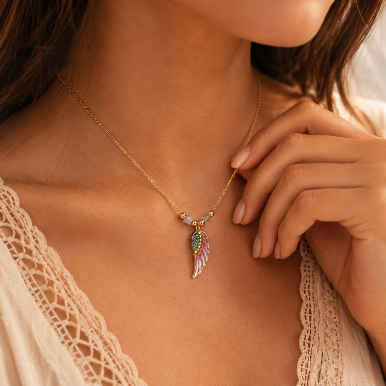 Rainbow angel wing pendant necklace with crystal accents on gold plated chain