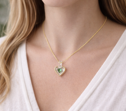 August birthstone heart necklace with light green peridot crystal pendant on 18 inch gold plated chain