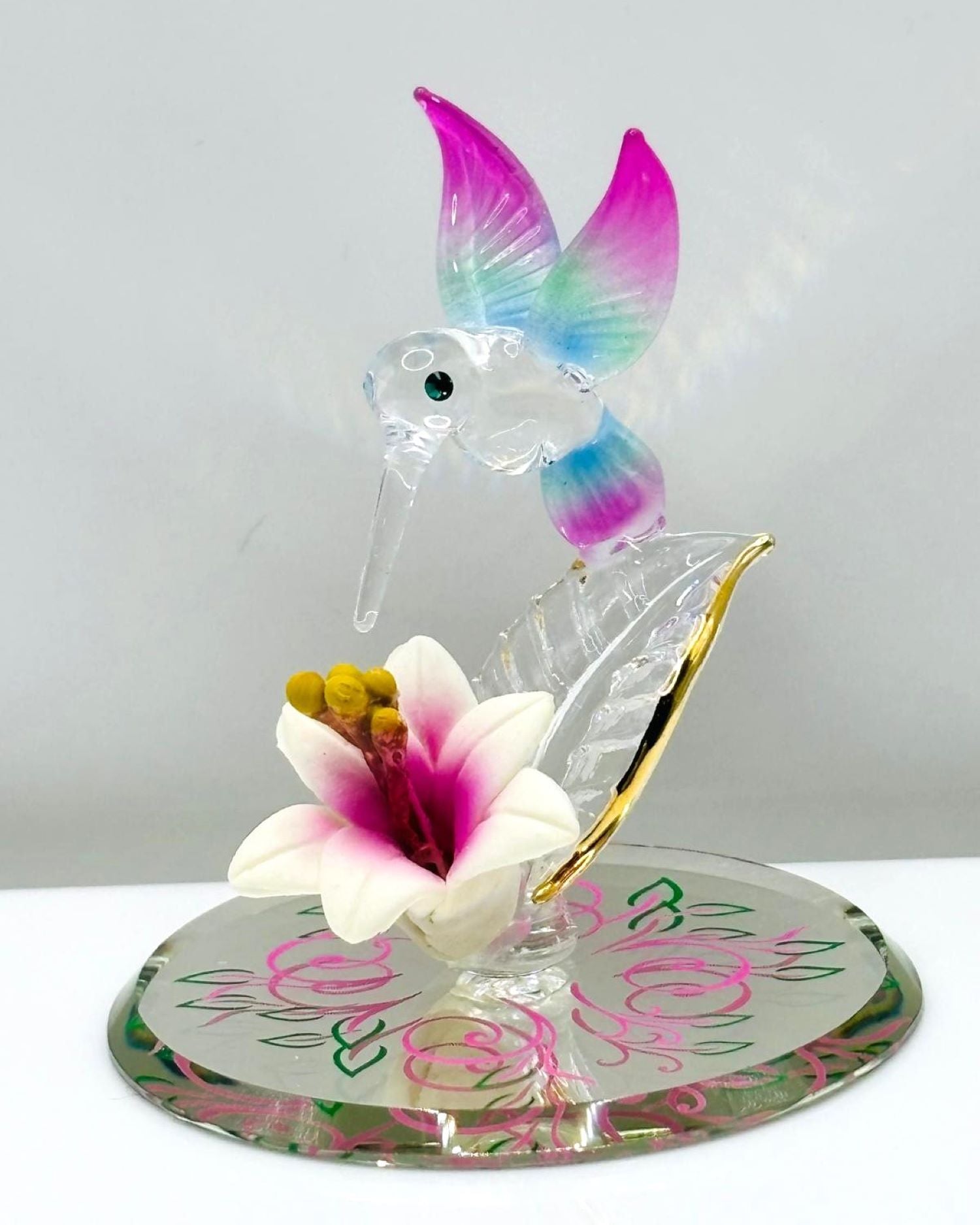 hummingbird glass figurine with multicolor wings over pink lily on mirror base bird decor gift