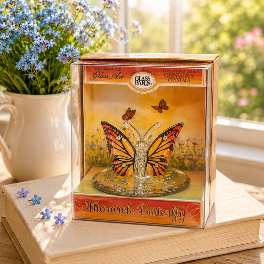 Handcrafted Monarch Butterfly glass figurine with genuine crystal accents displayed in a decorative keepsake box on a mirrored base.