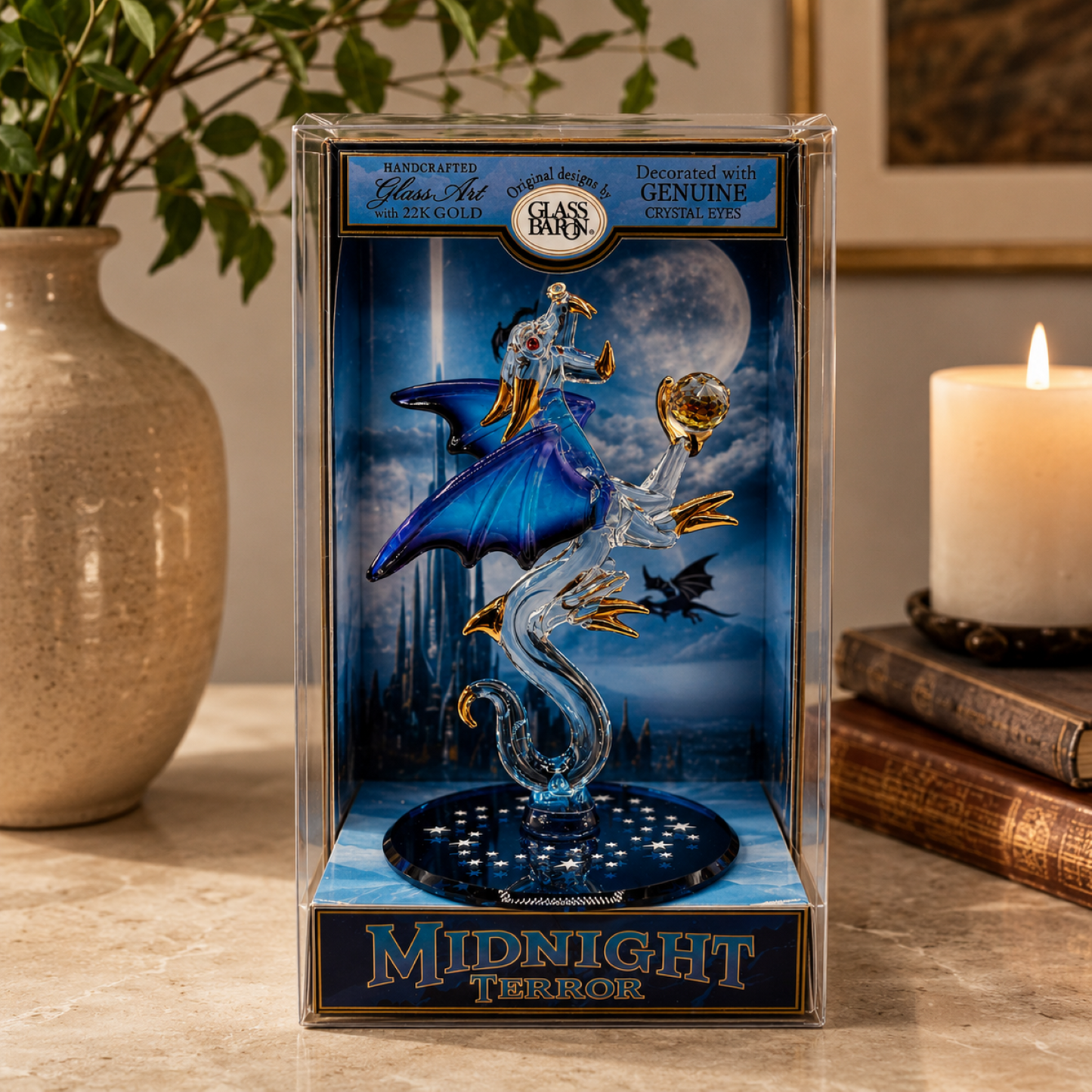 Handcrafted blue and clear glass dragon figurine with Genuine Crystal eyes and Real 22K Gold accents displayed inside a keepsake box.