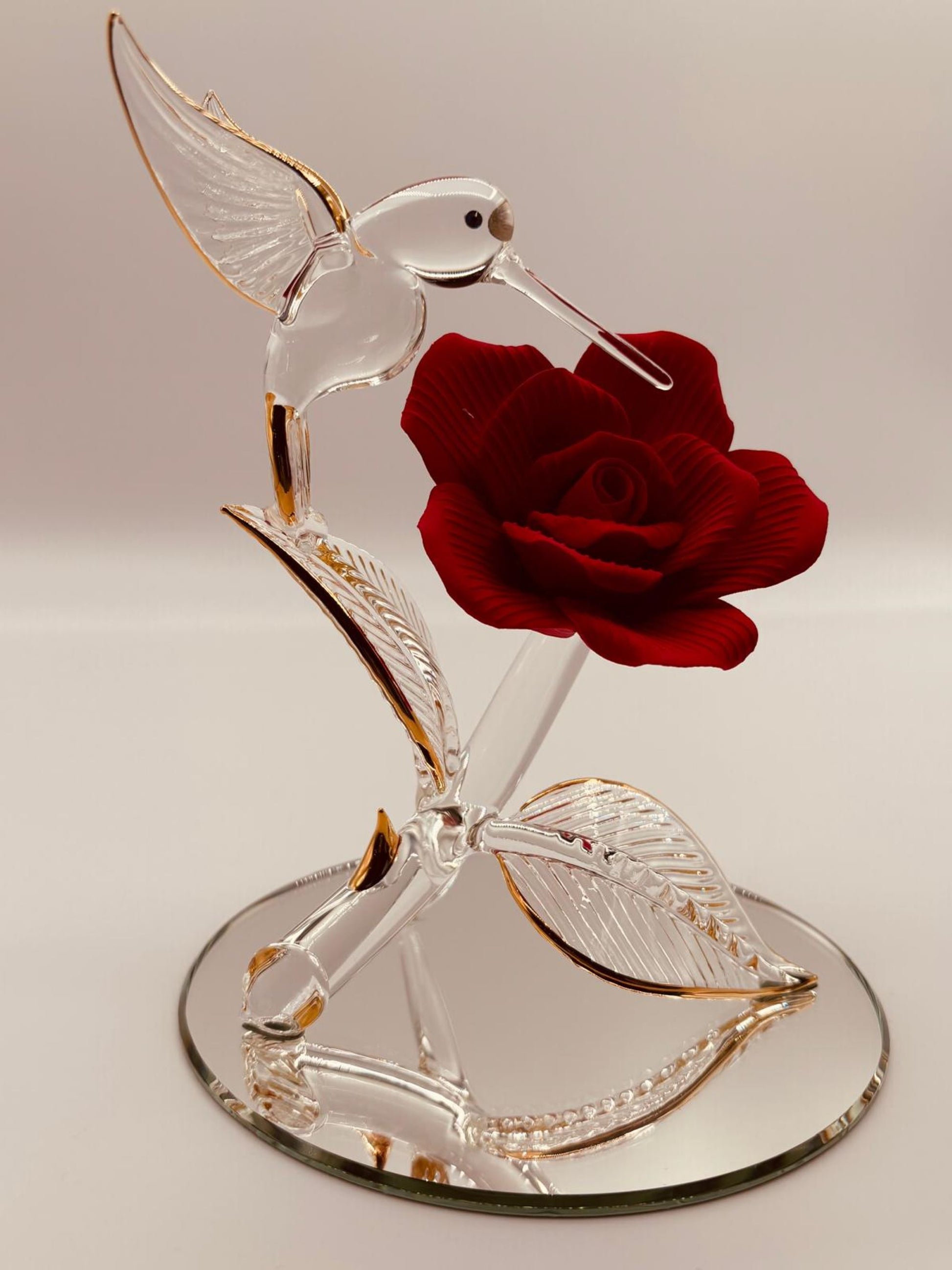 Handcrafted glass hummingbird with red rose on beveled mirror base with crystal and gold accents