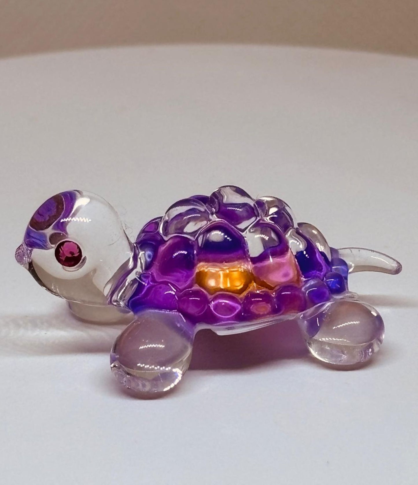 Handcrafted pink glass turtle figurine with crystal details