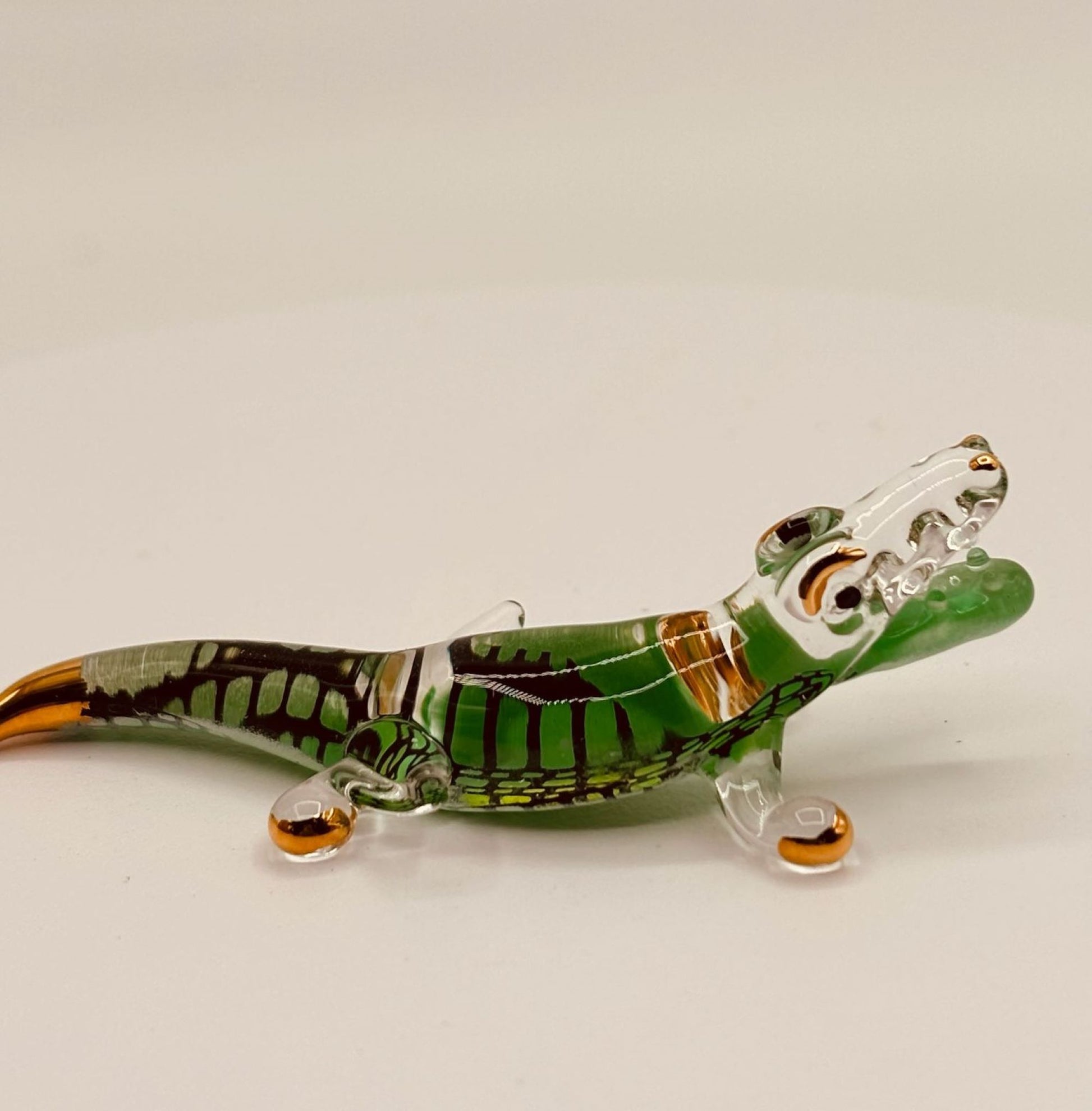 Handcrafted glass alligator figurine with air-brushed details and 22Kt gold accents