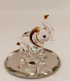 Handcrafted glass elephant figurine with crystal and 22Kt gold accents on a beveled mirror base