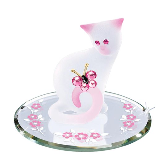 Pink and white glass cat figurine holding butterfly on mirror base