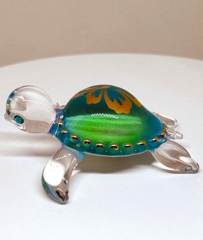 Handcrafted Aloha sea turtle glass figurine with green shell and flower design
