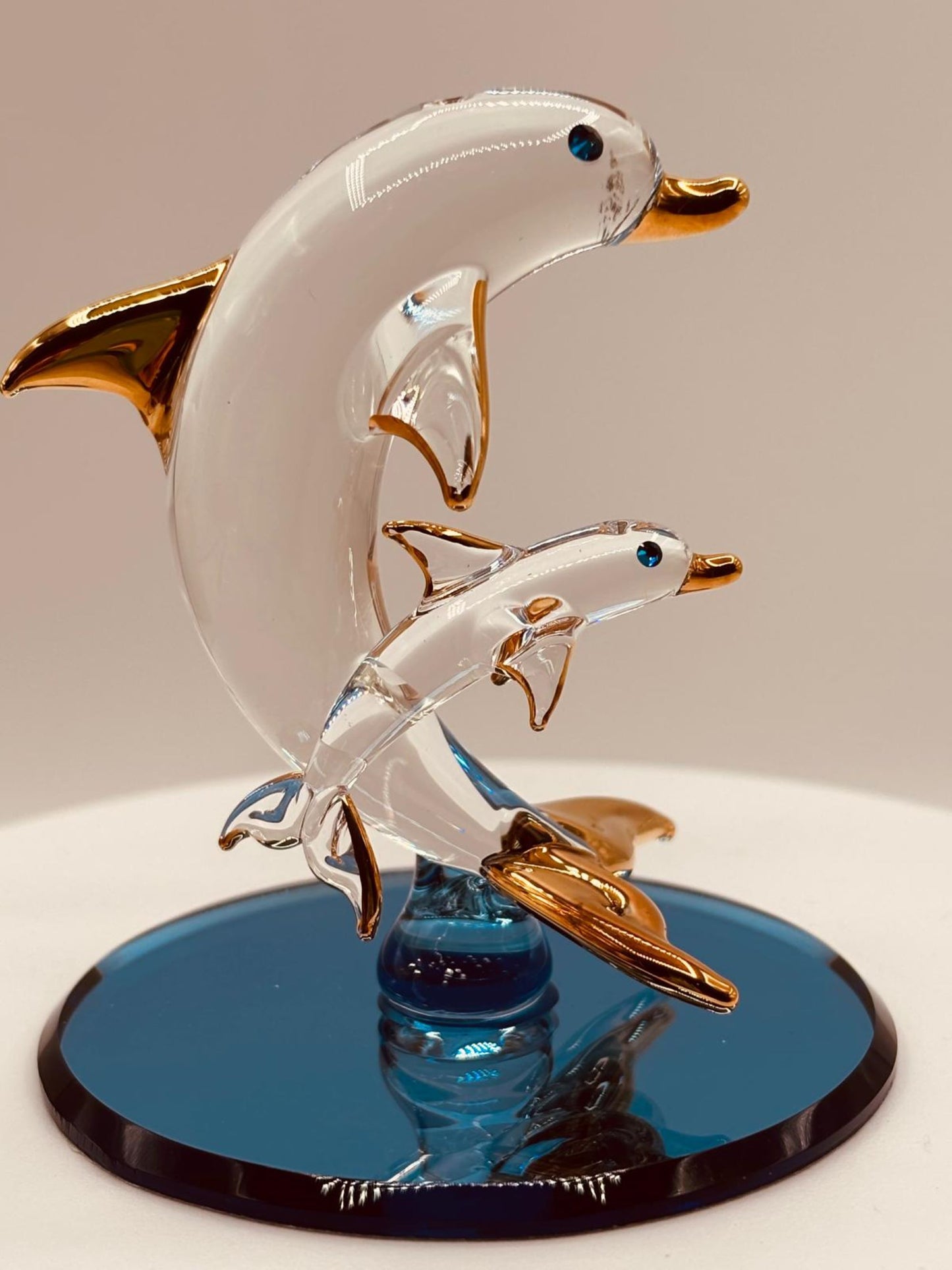 Ocean-themed dolphin collectible with crystal and gold accents