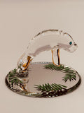 Handcrafted glass manatee figurine swimming in shallow water on a beveled mirror base with crystal and gold accents
