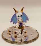 Handcrafted glass dragon holding a purple rose with crystal and 22Kt gold accents