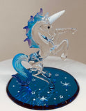 Handcrafted Starlight Unicorn glass figurine with blue mane on star-patterned base
