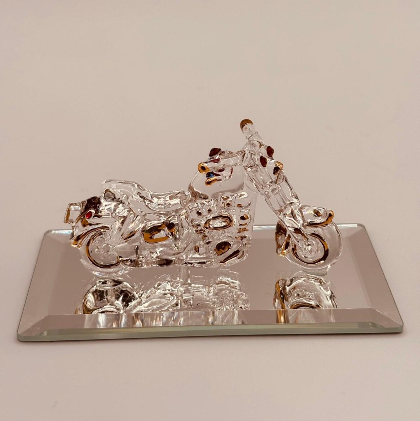 Handcrafted glass motorcycle figurine with crystal and 22Kt gold accents on a beveled mirror base