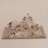 Handcrafted glass motorcycle figurine with crystal and 22Kt gold accents on a beveled mirror base