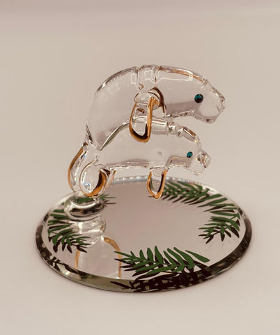 Handcrafted glass manatee with baby on a beveled mirror base with crystal and gold accents