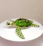 Handcrafted green glass sea turtle figurine with spotted flippers