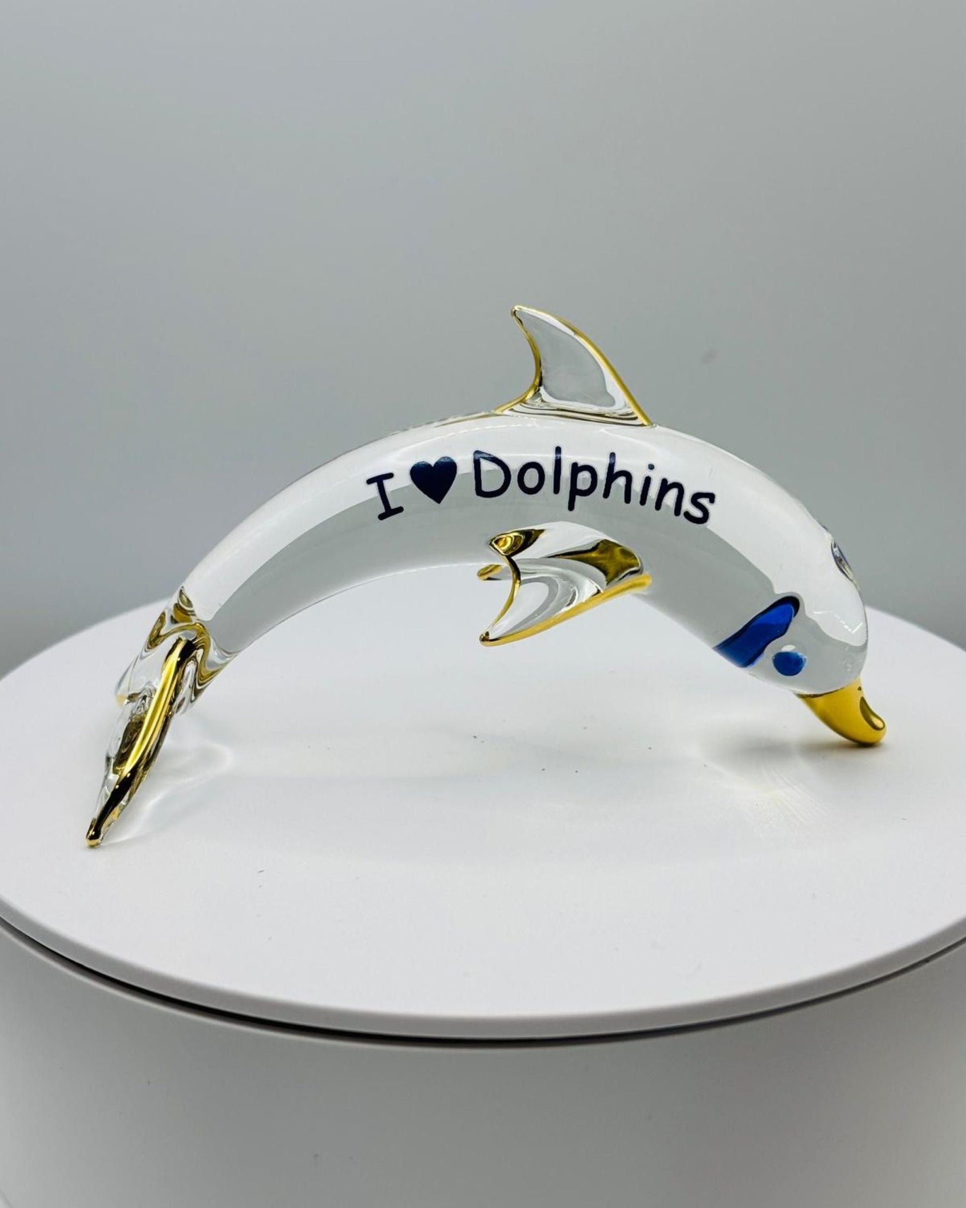 Glass dolphin figurine with I Love Dolphins message ocean themed decor