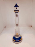 Handcrafted tall blue lighthouse glass figurine with etched spiral, cobalt accents, crystals, and gold trim