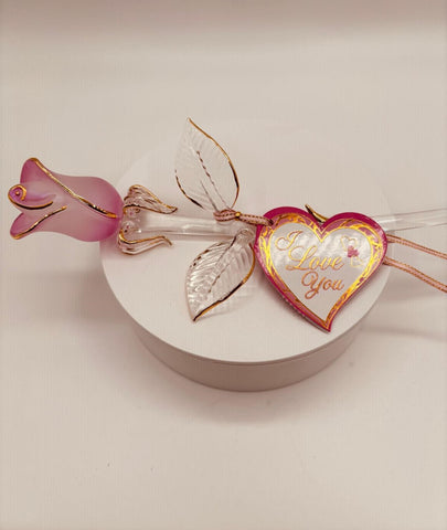 Handcrafted pink pearl glass rose with 22Kt gold accents and heart tag reading “I Love You,” tied with pink and gold ribbon