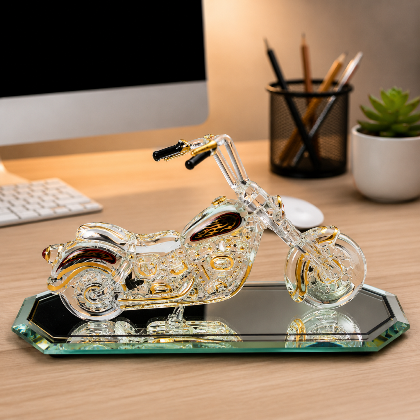 Handcrafted glass motorcycle figurine with Genuine Crystals and 22Kt Gold accents displayed on a beveled glass mirror base.