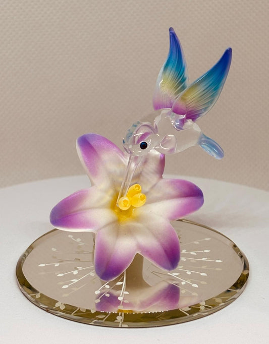 Handcrafted hummingbird figurine with lavender lily and crystal accents
