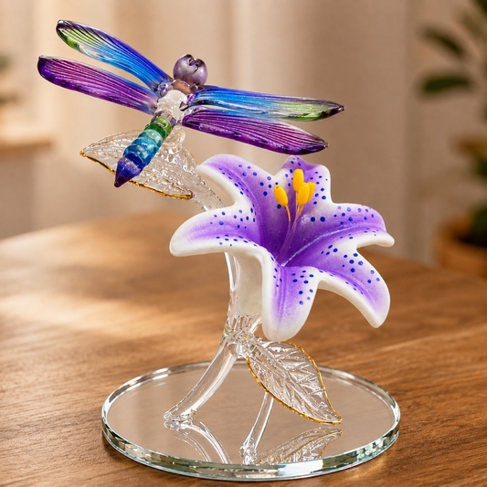 Handcrafted glass dragonfly figurine perched on a purple tiger lily with real 22Kt gold accents and hand-beveled glass mirror base