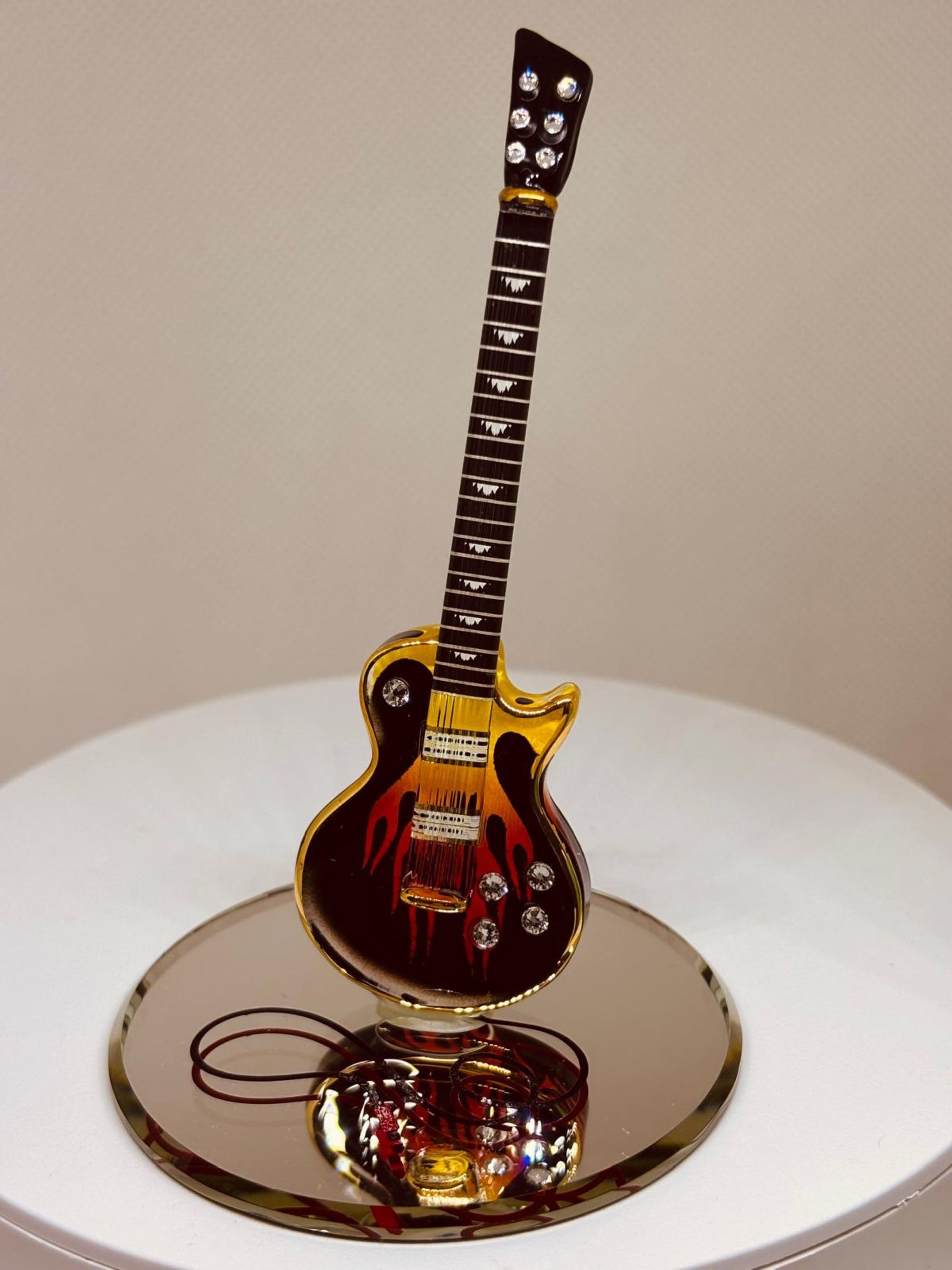 Handcrafted Smokin’ Hot guitar figurine with wood grain design and crystal accents