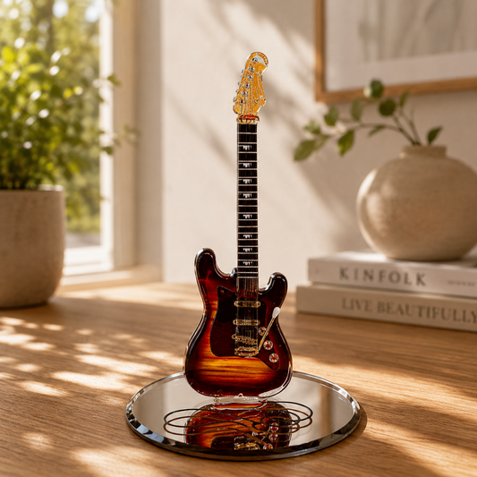 Handcrafted glass vintage guitar figurine with Genuine Crystals and Real 22Kt Gold displayed on a beveled mirror base with guitar cord design.