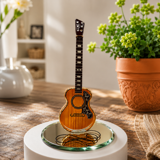 Handcrafted glass acoustic guitar figurine on a beveled mirror base with Genuine Crystals and Real 22Kt Gold accents.
