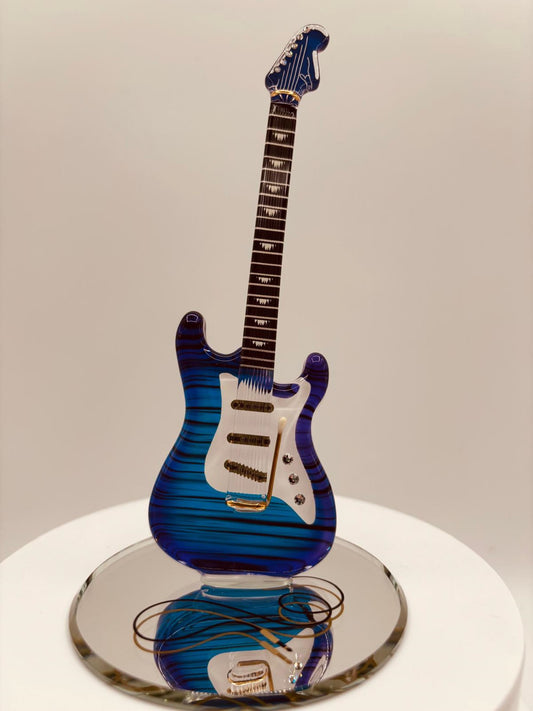 Music-themed guitar décor with gold and crystal accents