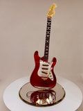 Handcrafted vintage red guitar figurine with crystal accents