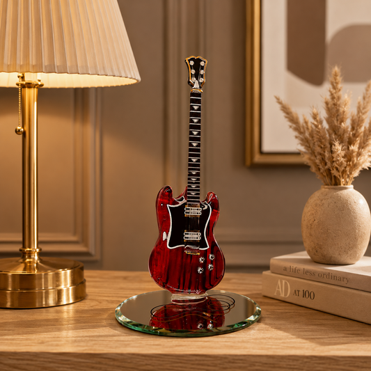 Handcrafted red glass electric guitar figurine with Genuine Crystals and Real 22Kt Gold displayed on a beveled mirror base.