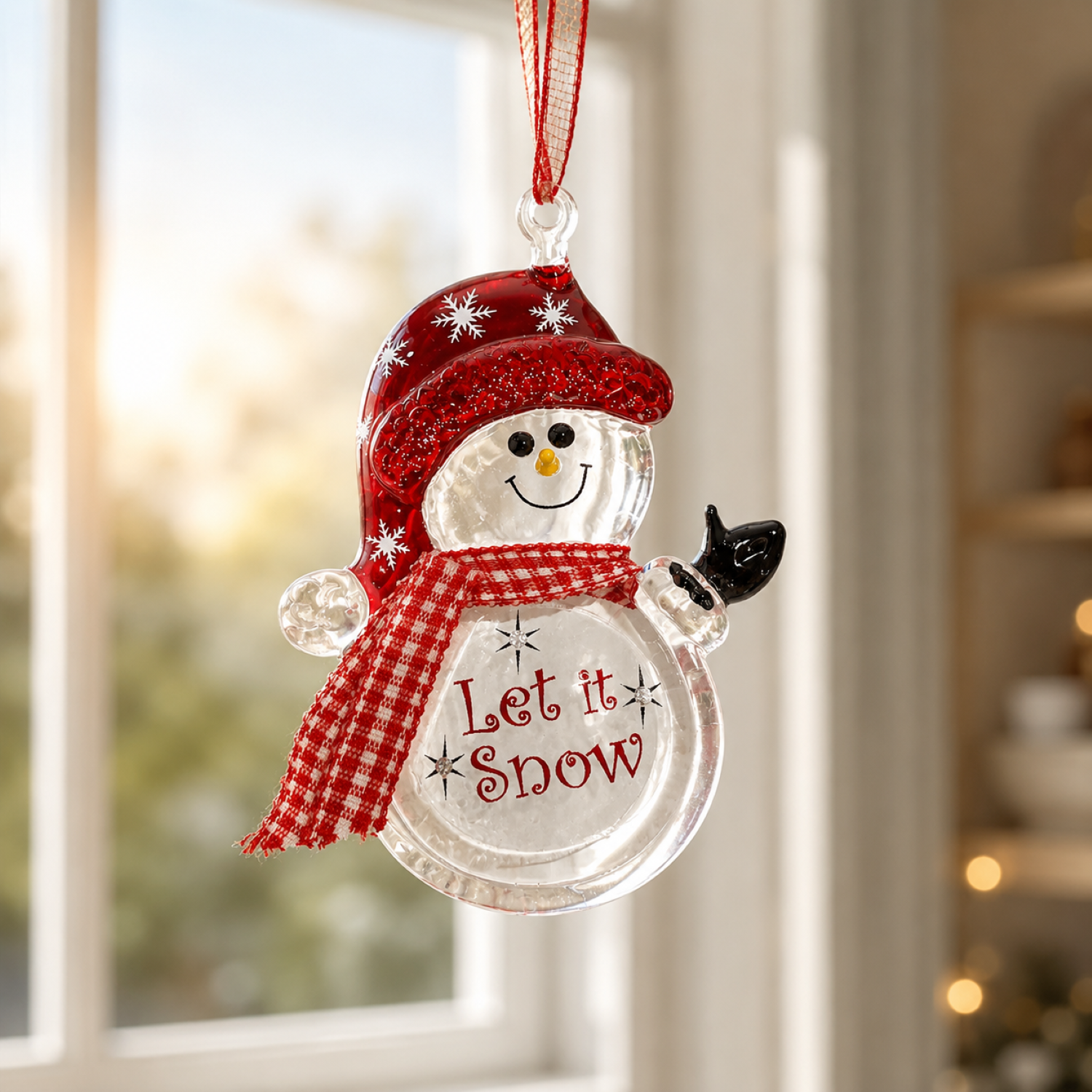 Handcrafted glass snowman Christmas ornament with red snowflake hat, plaid scarf, genuine crystal accents, and "Let It Snow" message hanging from a ribbon.