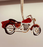 Handcrafted red motorcycle ornament with crystals and 22Kt gold hanging from a gold ribbon