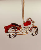 Handcrafted red motorcycle ornament with crystals and 22Kt gold hanging from a gold ribbon