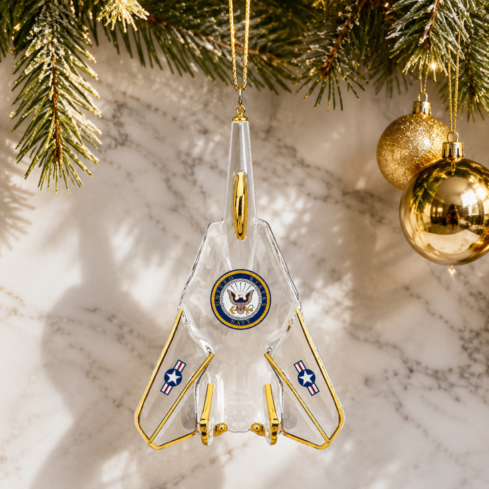 Official U.S. Navy handcrafted glass fighter jet Christmas ornament with Navy emblem, Real 22Kt Gold accents, and gold hanging ribbon.