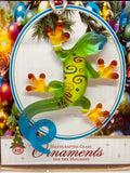 Handcrafted glass Christmas gecko ornament with colorful design and crystal eyes