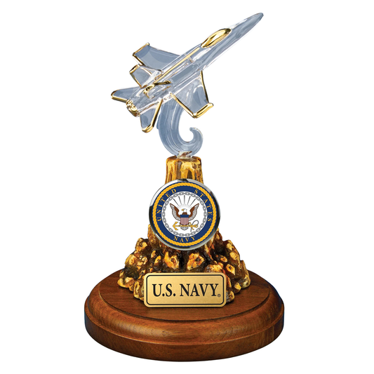 Handcrafted U.S. Navy F-18 Fighter Jet glass figurine with gold accents mounted on decorative wooden base with official Navy emblem and plaque.