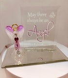 Handcrafted glass angel figurine holding purple crystal heart on beveled mirror base